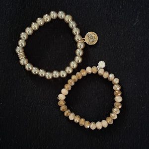 A pair of Bracelets - not real pearls - super cute and elastic